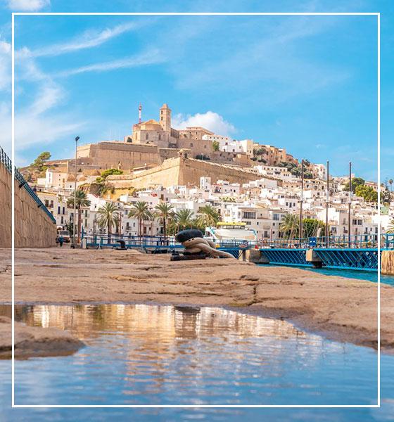 view of the wall of Ibiza's coastal town in BitHome Ibiza